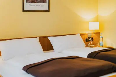 Ein Bett oder Betten in einem Zimmer der Unterkunft Hotel Achtermann