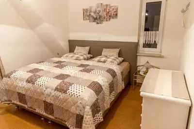 Ein Bett oder Betten in einem Zimmer der Unterkunft Ferienwohnung-Schwanke