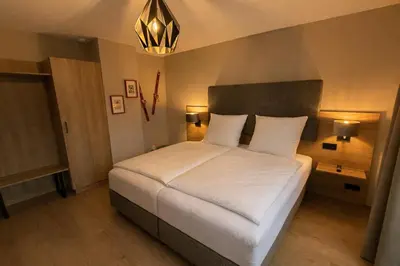 Ein Bett oder Betten in einem Zimmer der Unterkunft Bergflamme - Ihr Ferienhaus im Harz mit Sauna