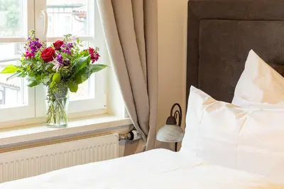 Ein Bett oder Betten in einem Zimmer der Unterkunft Hubertus Hof