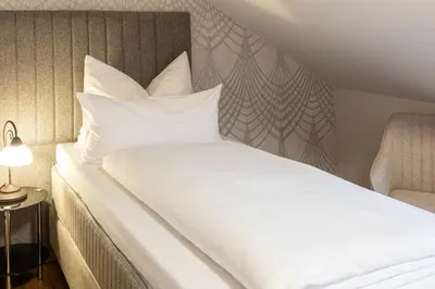 Ein Bett oder Betten in einem Zimmer der Unterkunft Hubertus Hof