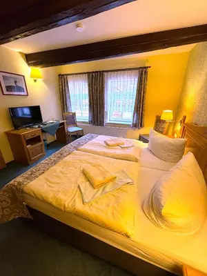 Ein Bett oder Betten in einem Zimmer der Unterkunft Gasthaus Kupfer