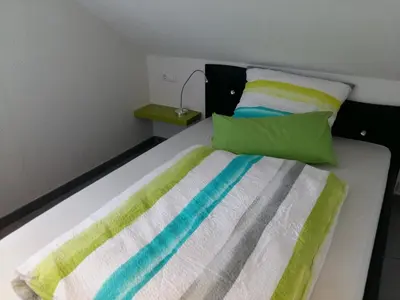 Ein Bett oder Betten in einem Zimmer der Unterkunft Ferien in Goslar, Freiers Ferienwohnungen
