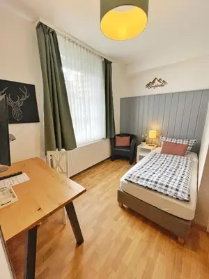 Ein Bett oder Betten in einem Zimmer der Unterkunft Pension Trautheim - Am Stadtpark
