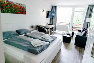 Ein Bett oder Betten in einem Zimmer der Unterkunft Appartements Am Kranichsee