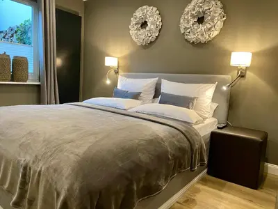 Ein Bett oder Betten in einem Zimmer der Unterkunft country-suites by verdino LIVING - Apartments & Privatzimmer
