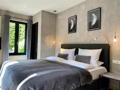 Ein Bett oder Betten in einem Zimmer der Unterkunft country-suites by verdino LIVING - Apartments & Privatzimmer