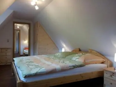 Ein Bett oder Betten in einem Zimmer der Unterkunft Ferienhaus am Oeringer Tor