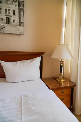 Ein Bett oder Betten in einem Zimmer der Unterkunft Klosterhotel Wöltingerode