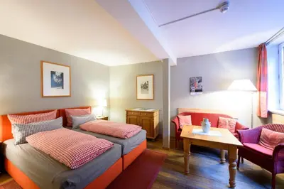 Ein Bett oder Betten in einem Zimmer der Unterkunft Hotel Pension St Nikolai