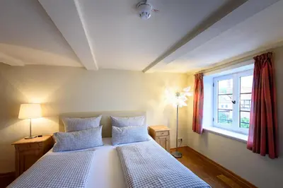 Ein Bett oder Betten in einem Zimmer der Unterkunft Hotel Pension St Nikolai