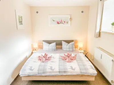 Ein Bett oder Betten in einem Zimmer der Unterkunft Alte Försterei