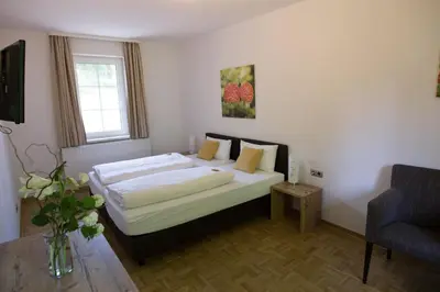 Ein Bett oder Betten in einem Zimmer der Unterkunft BSW-Erlebnishotel Festenburg