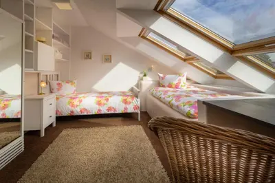 Ein Bett oder Betten in einem Zimmer der Unterkunft Exklusive Dachgeschosswohnung mit Harzblick