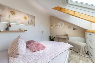 Ein Bett oder Betten in einem Zimmer der Unterkunft Exklusive Dachgeschosswohnung mit Harzblick