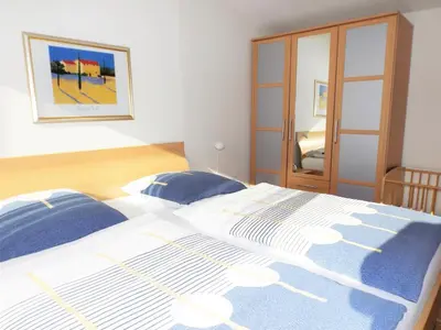 Ein Bett oder Betten in einem Zimmer der Unterkunft Premium-Ferienwohnungen Bergblick im Haus Hopfe