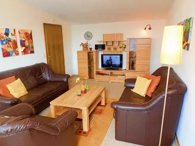 Ein Sitzbereich in der Unterkunft Premium-Ferienwohnungen Bergblick im Haus Hopfe