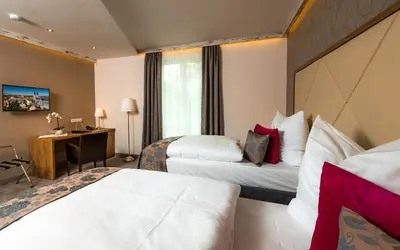 Ein Bett oder Betten in einem Zimmer der Unterkunft Hotel Allegro