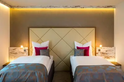Ein Bett oder Betten in einem Zimmer der Unterkunft Hotel Allegro