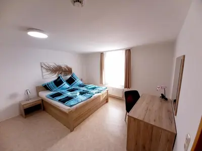 Ein Bett oder Betten in einem Zimmer der Unterkunft Ferienwohnung Ballstrasse 28