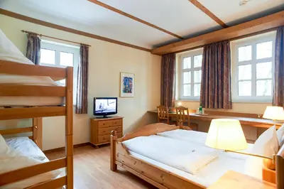Ein Bett oder Betten in einem Zimmer der Unterkunft Hotel Zum Harzer