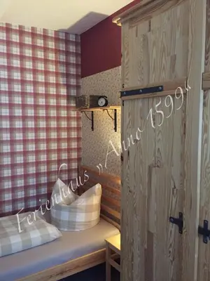 Ein Bett oder Betten in einem Zimmer der Unterkunft Ferienhaus Anno 1599
