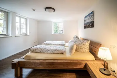 Ein Bett oder Betten in einem Zimmer der Unterkunft Ferienwohnungen Finkenherd 5