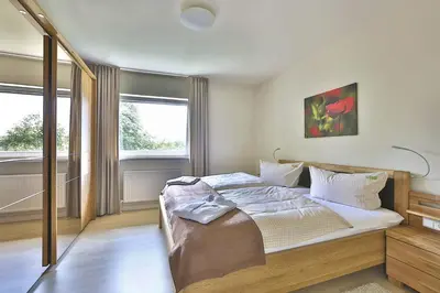 Ein Bett oder Betten in einem Zimmer der Unterkunft Landhäuser Bergwiese