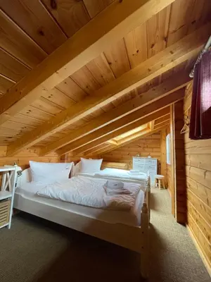 Ein Bett oder Betten in einem Zimmer der Unterkunft Blockhaus an der Skiwiese Braunlage