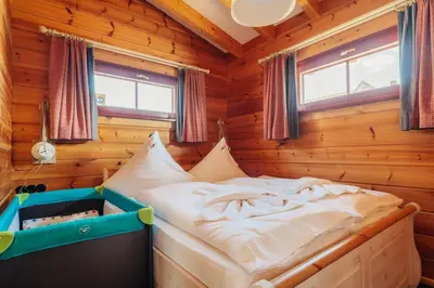 Ein Bett oder Betten in einem Zimmer der Unterkunft Blockhaus an der Skiwiese Braunlage