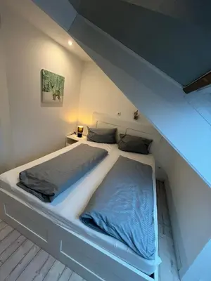 Ein Bett oder Betten in einem Zimmer der Unterkunft Fewo Schröder - Harzflair - inklusive Bettwäsche
