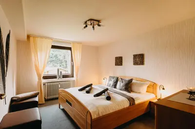 Ein Bett oder Betten in einem Zimmer der Unterkunft Kleiner Bergzauber