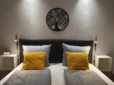 Ein Bett oder Betten in einem Zimmer der Unterkunft Harz Enjoy - Vier Jahreszeiten