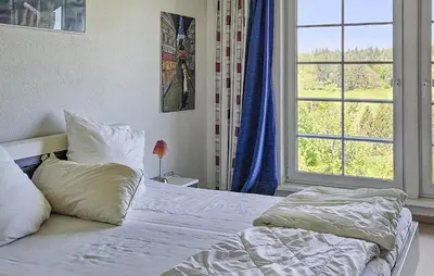 Ein Bett oder Betten in einem Zimmer der Unterkunft Galerie Haus