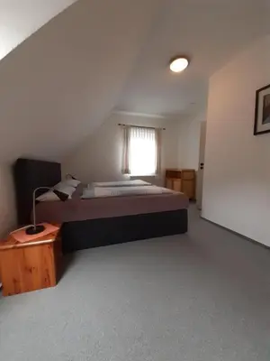 Ein Bett oder Betten in einem Zimmer der Unterkunft Ferienwohnung Stricker 3/3