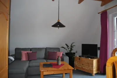 Ein Sitzbereich in der Unterkunft Ferienwohnung Stricker Typ A, Balkon 1/3