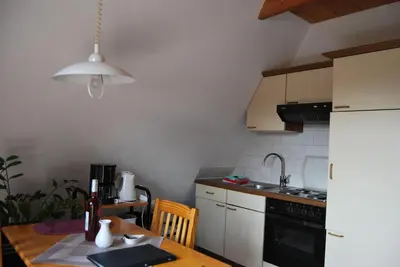 Küche/Küchenzeile in der Unterkunft Ferienwohnung Stricker Typ A, Balkon 2/3