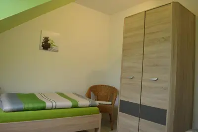 Ein Bett oder Betten in einem Zimmer der Unterkunft Ferienwohnung Holzberger