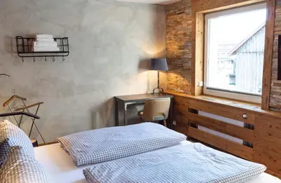 Ein Bett oder Betten in einem Zimmer der Unterkunft StrandBerg's Die Hütten 550 üNN