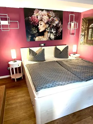 Ein Bett oder Betten in einem Zimmer der Unterkunft Pension Victoria Halberstadt