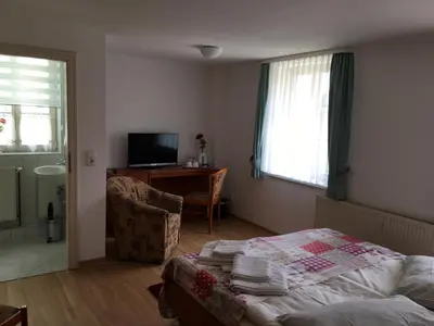 Ein Bett oder Betten in einem Zimmer der Unterkunft Haus Heinrich Heine