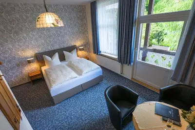 Ein Bett oder Betten in einem Zimmer der Unterkunft Pension Schweizer Hof