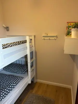 Ein Bett oder Betten in einem Zimmer der Unterkunft Ferienwohnung Glockenberg - Westphal