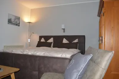 Ein Bett oder Betten in einem Zimmer der Unterkunft Hoffmann's Apartment in der Residenz Bocksbergblick