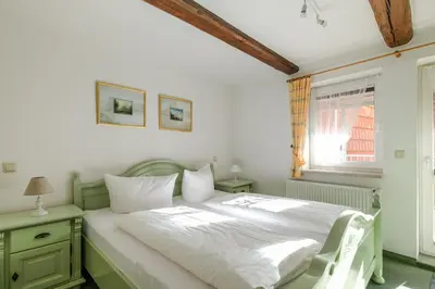 Ein Bett oder Betten in einem Zimmer der Unterkunft Ferienwohnungen am Markt