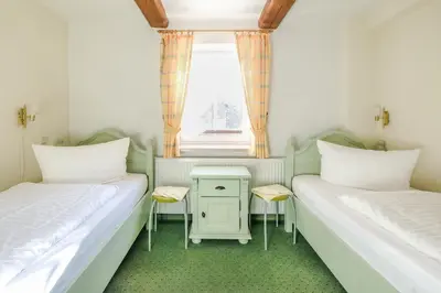 Ein Bett oder Betten in einem Zimmer der Unterkunft Ferienwohnungen am Markt