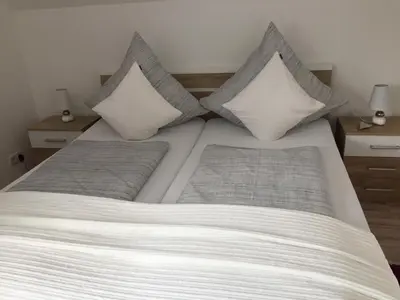 Ein Bett oder Betten in einem Zimmer der Unterkunft Ferienwohnung Unikat Harz
