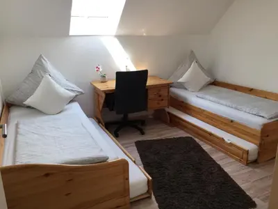 Ein Bett oder Betten in einem Zimmer der Unterkunft Ferienwohnung Unikat Harz