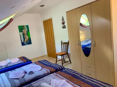 Ein Bett oder Betten in einem Zimmer der Unterkunft Ferienhaus Erika