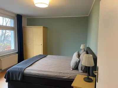 Ein Bett oder Betten in einem Zimmer der Unterkunft Ferienwohnung 